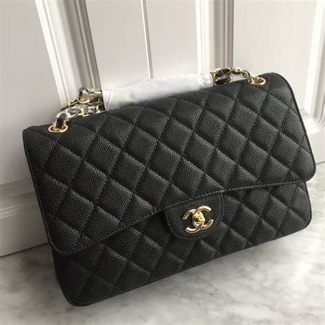 black chanel bag gold|Chanel black classic flap bag.